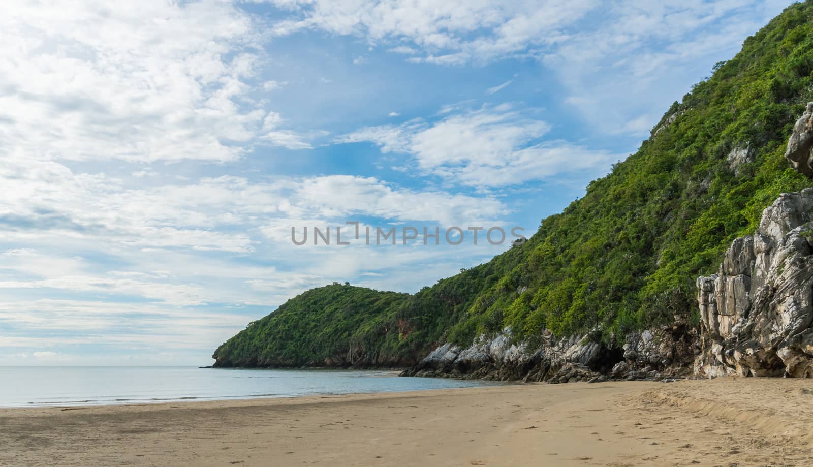 Khao Kalok rock or stone mountain on Khao Kalok beach in Thailand. Natural attractions in Thailand travel. The Khao Kalok rock mountain and green tree 
background