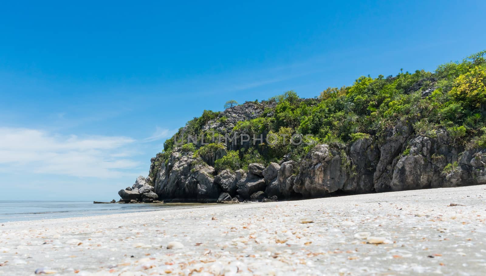 Rock or stone mountain or hill and blue sky low angle view at Sam Phraya beach Prachuap Khiri Khan Thailand. Landscape or scenery in 
natural for summer concept