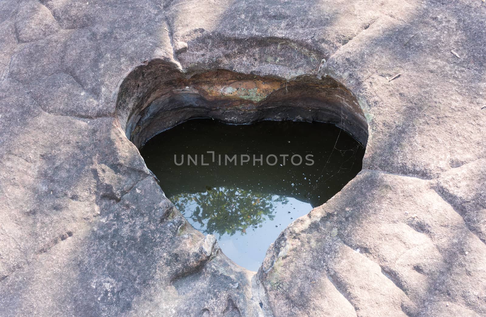 Natural Heart Shape Stone Pond at Phayao Attraction Northern Thailand Travel. Natural heart shape pond with warm sun light and water at Phayao landmark northern Thailand travel