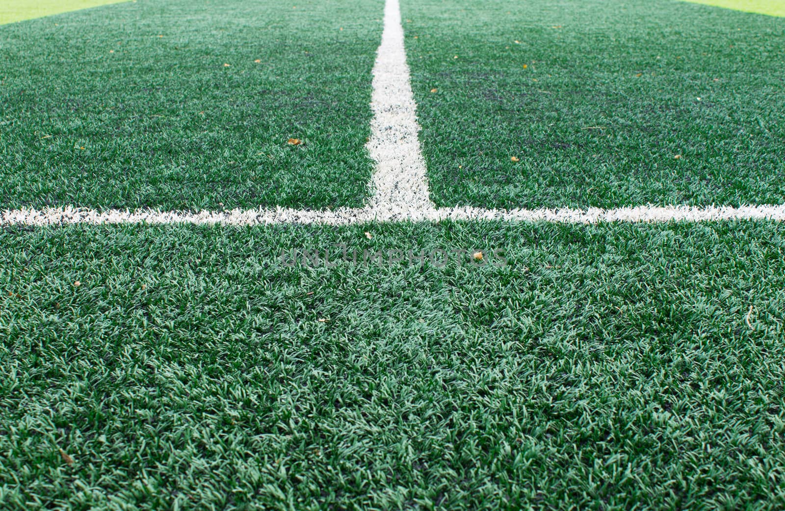 White sideline on green football field. Sideline on green artificial grass background