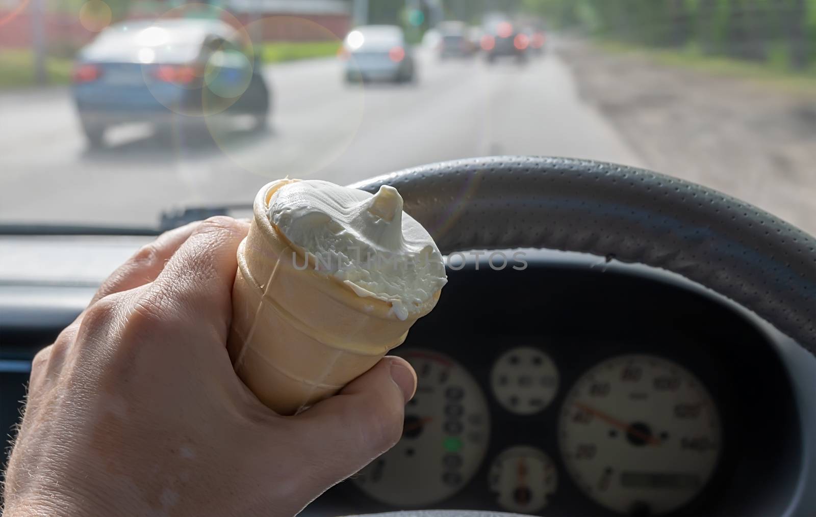 ice cream in the hand of the driver of the car by jk3030