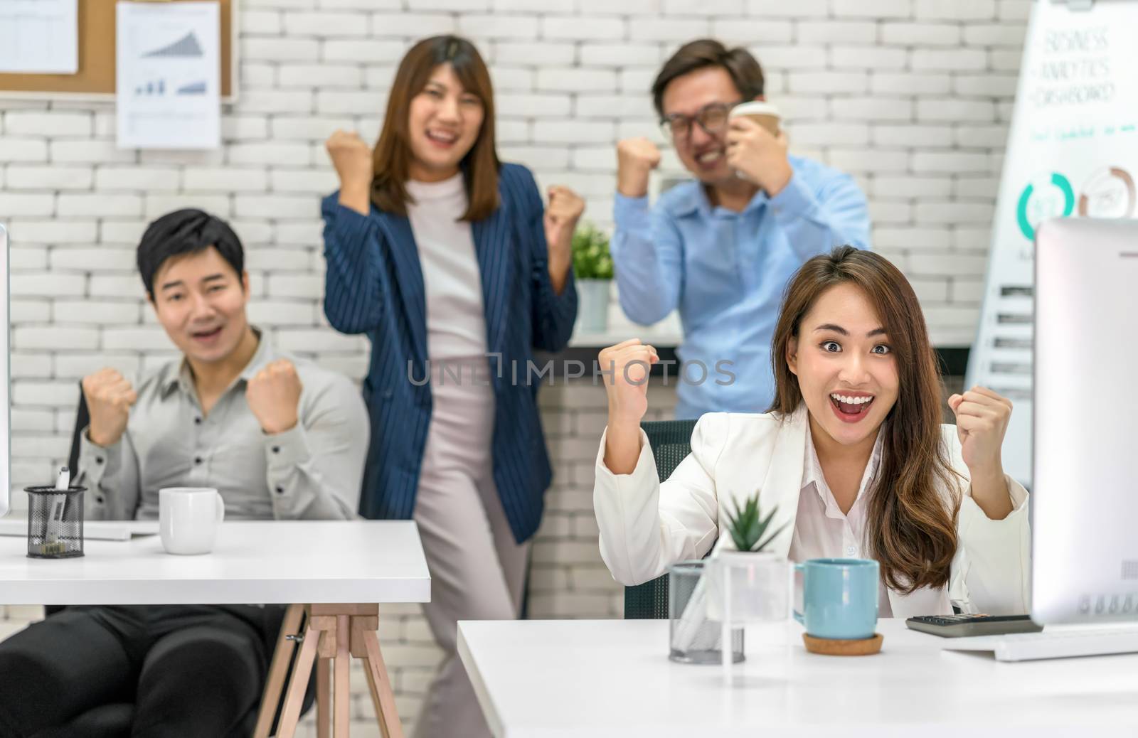 Group Of Asian Business people celebrating and showing thumbs up together with happiness action and in the modern Office, Project succeed and teamwork successful, people business group concept