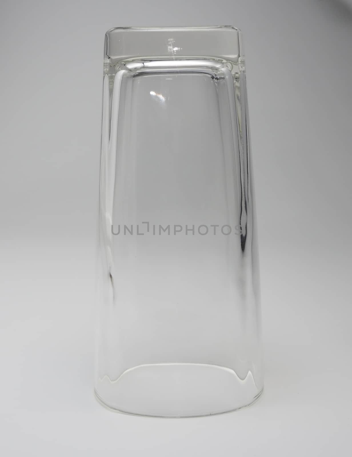 Empty glass Upside down on a white background.