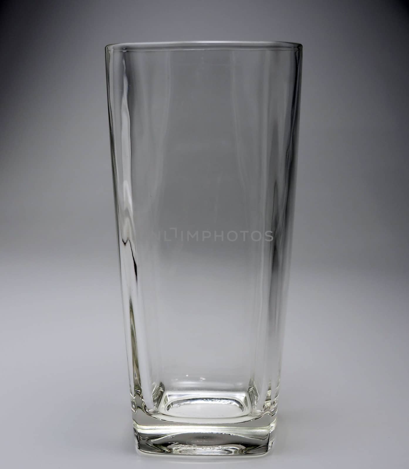 Empty glass On a gray background. by Unimages2527