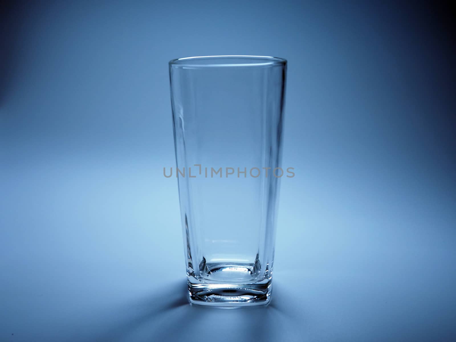 Empty glass On a blue background.
