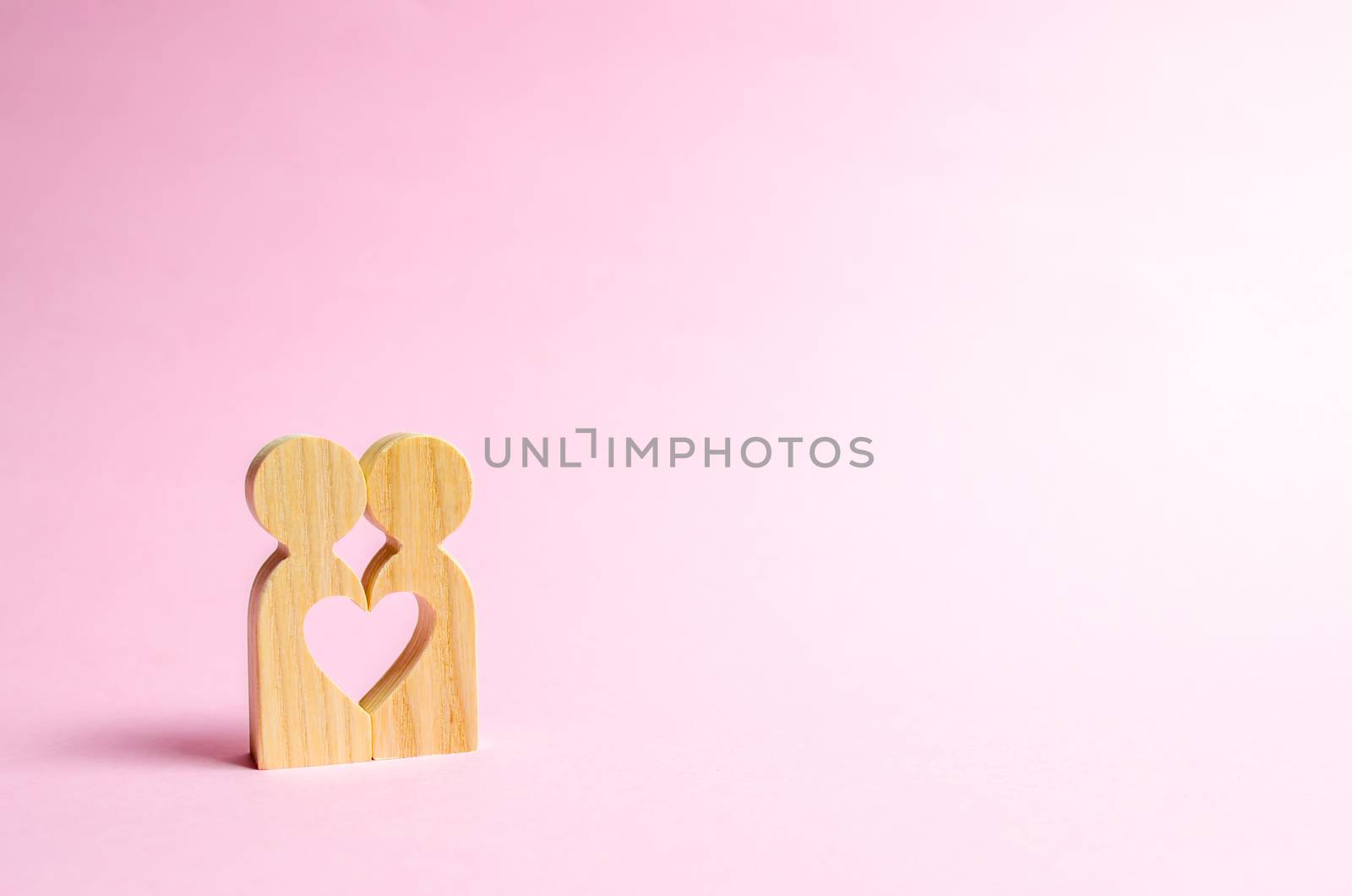 Figures of people stand together and form a heart-shaped void. Concept of love and relationships. Search for a partner and dating. Flirting, swingers. The second half on Valentine's Day.