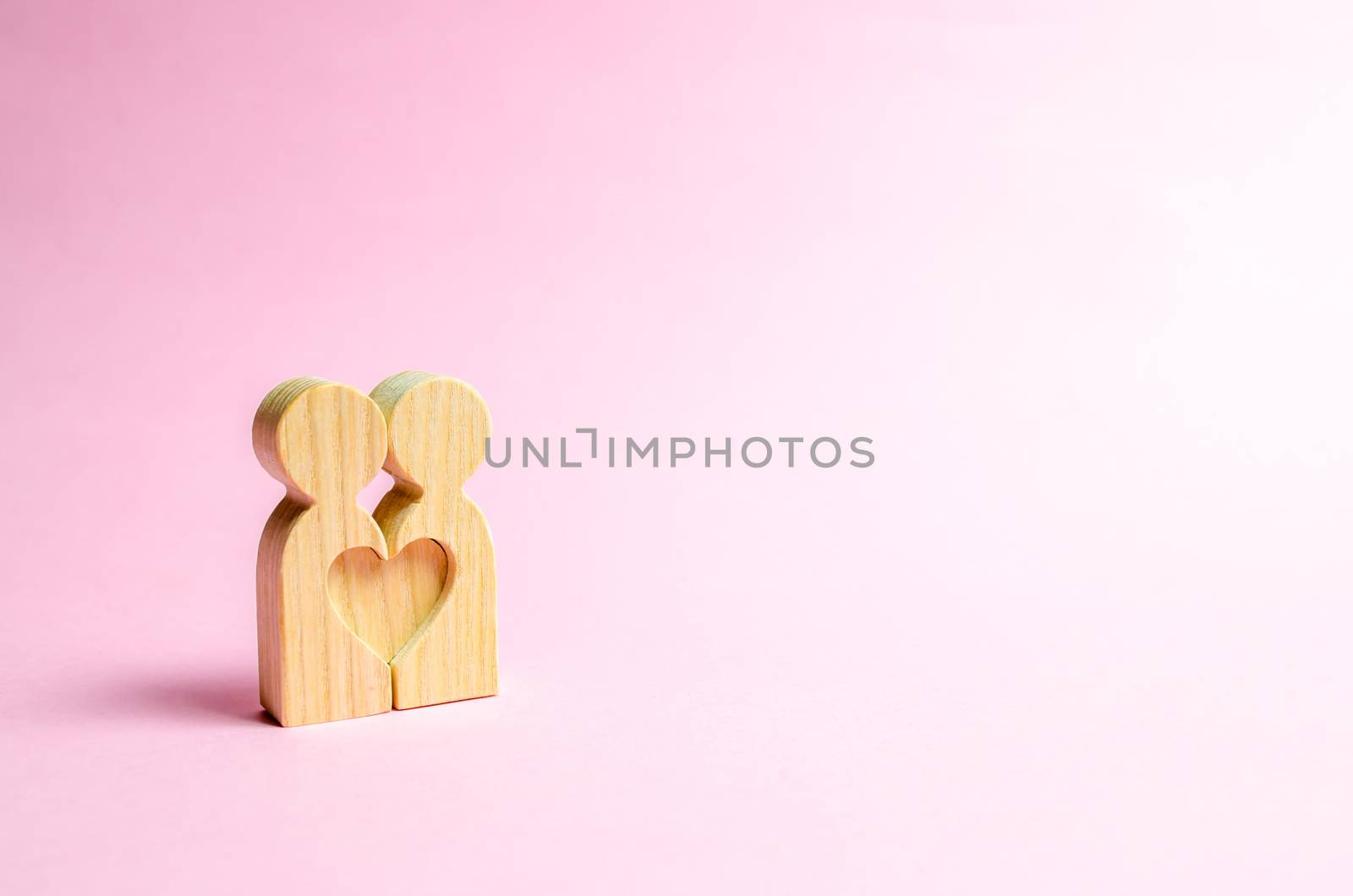 Figures of people stand together and form a heart shape. Concept of love and relationships. Search for a soulmate and dating. Flirting, swingers. The second half on Valentine's Day.