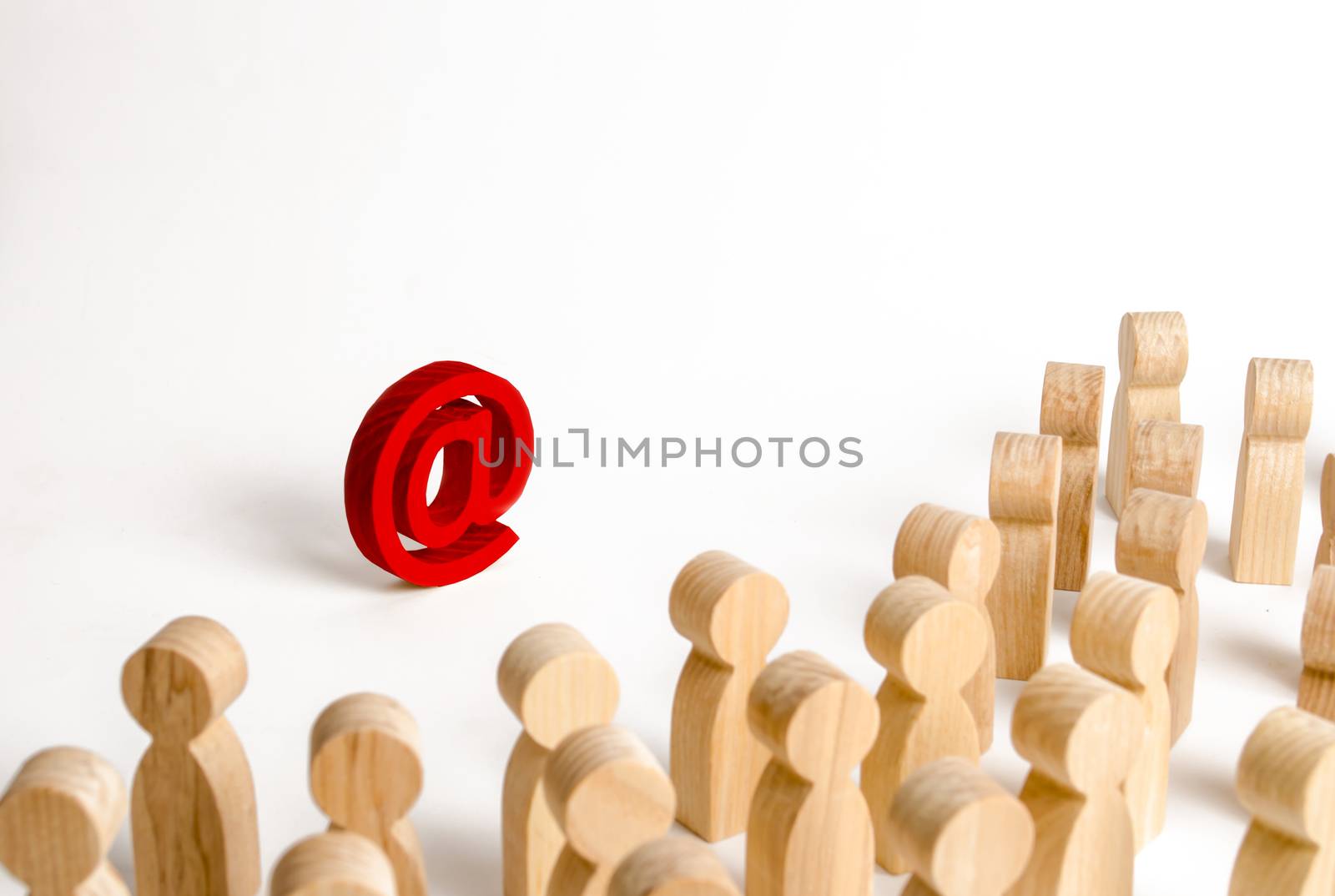 A large crowd of people looking at an email icon on a white background. The concept of e-mail and the Internet, communication and communication. Firewall, Internet restriction and censorship
