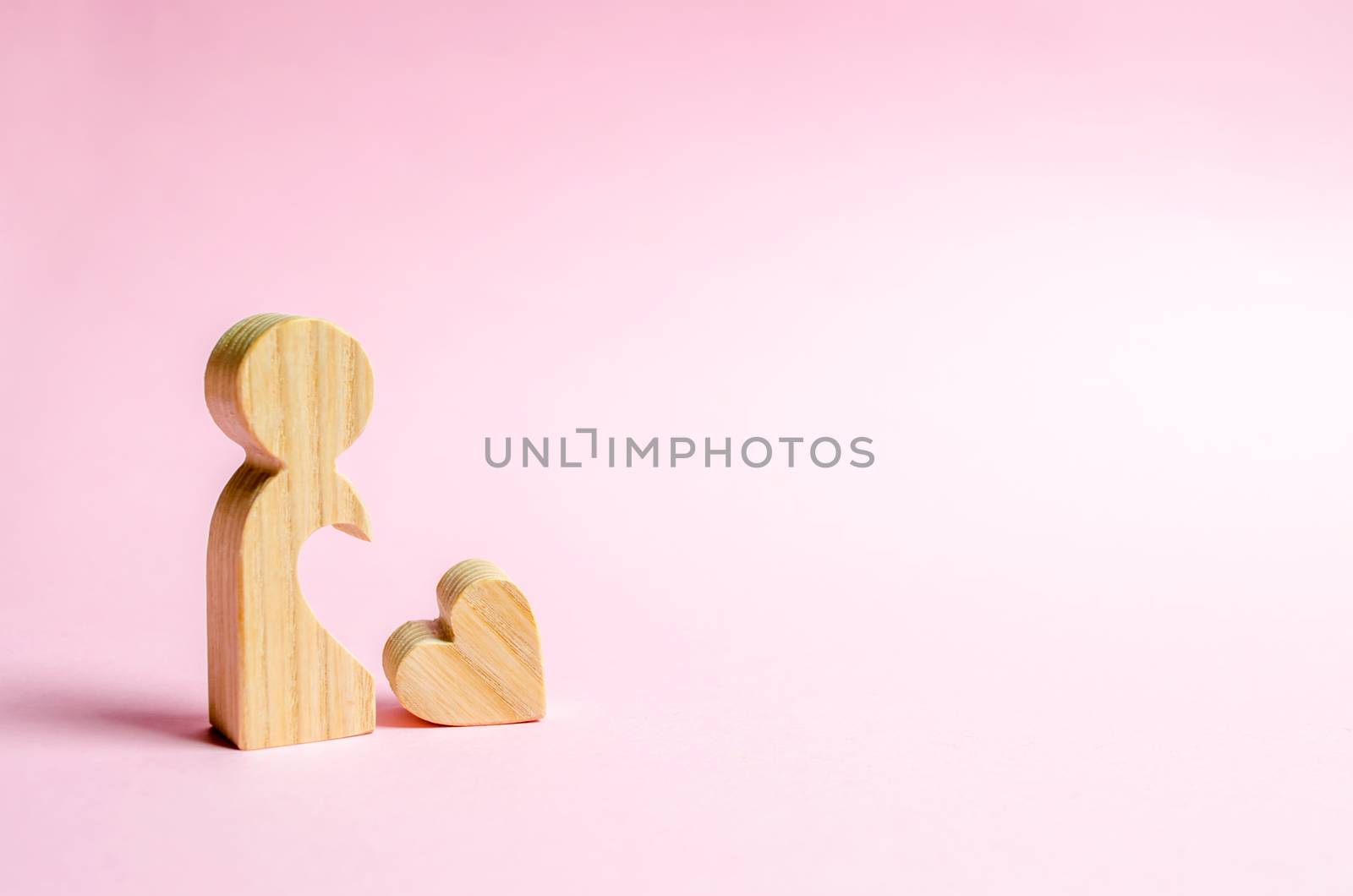 A lonely figure of a man or a woman with a heart that has dropped out of her body. Love search concept. Dating on Valentine's Day. The desire to find a relationship and love partner. Loneliness