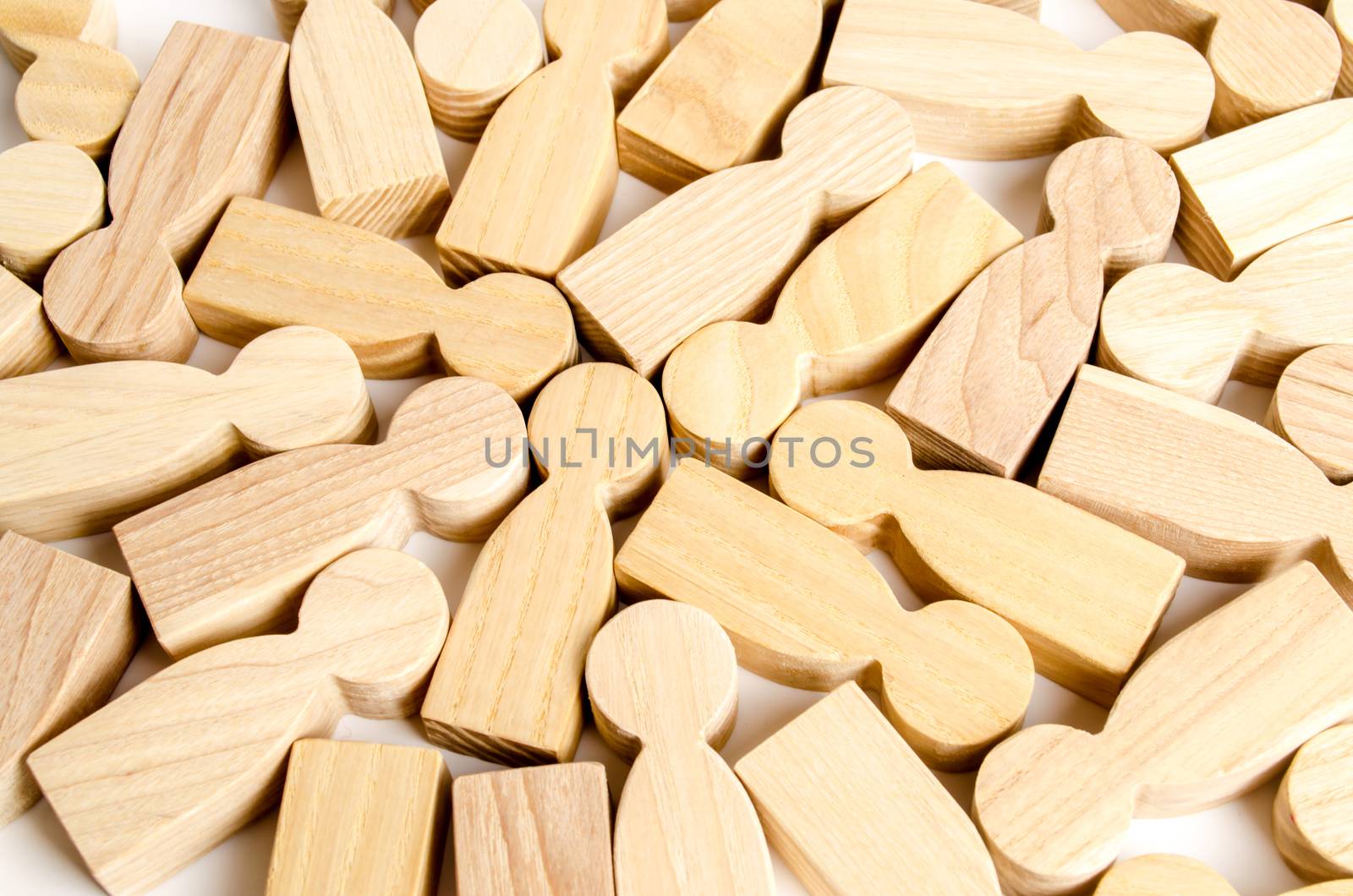 Background from a set of wooden figures of people. A scattering of people, a crowd. the segmentation of consumers and customers, the study of crowd behavior. Statistics. Business team, teamwork