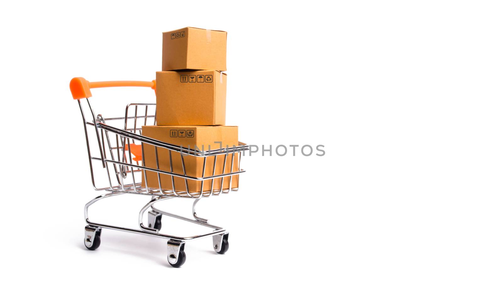 Supermarket cart with boxes, merchandise: the concept of buying and selling goods and services, internet commerce, online shopping, trade and turnover. Import and export, purchasing power.
