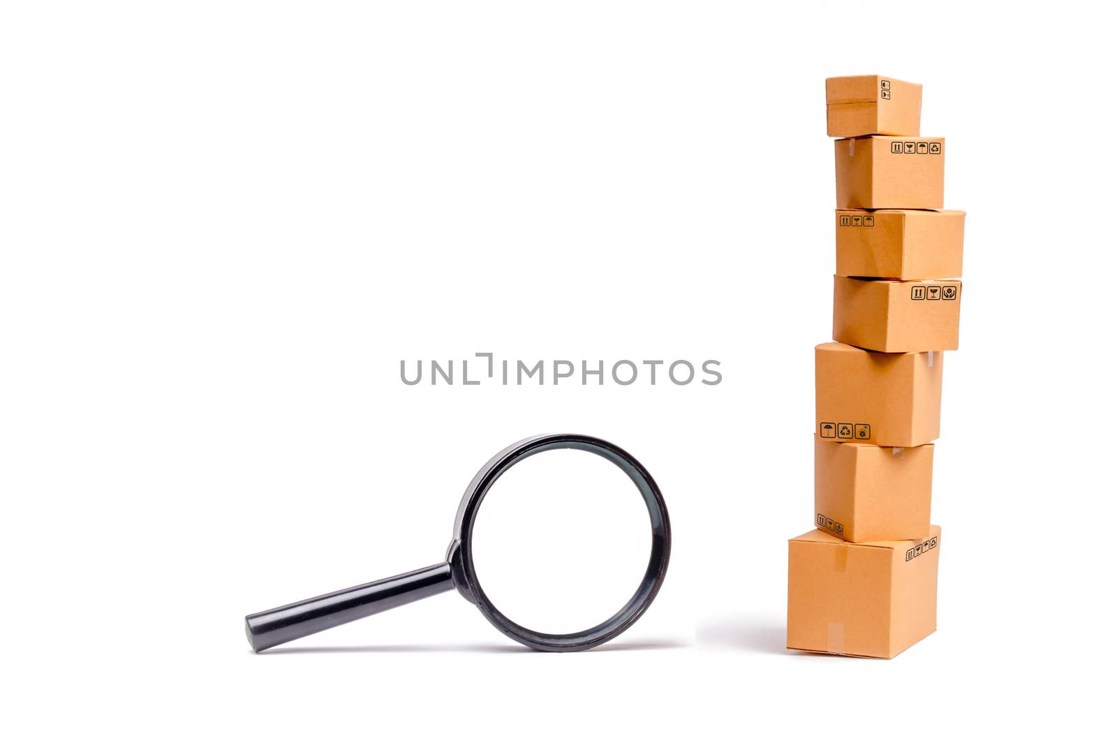 Cardboard boxes and a glass on a white background. The concept of packing goods, sending orders to customers. Warehouse of finished products and equipment. Moving to another house.