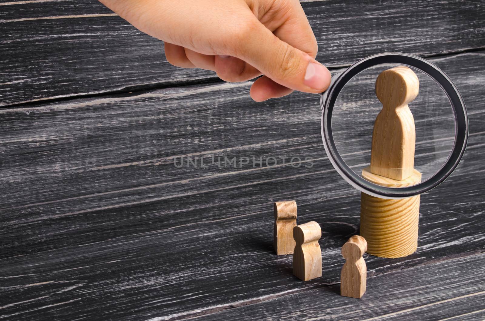Magnifying glass is looking at the men stands on the podium and broadcasts his thoughts and ideas to listeners. person gives orders, the leader, the boss. Pride, boastfulness. Head of the collective