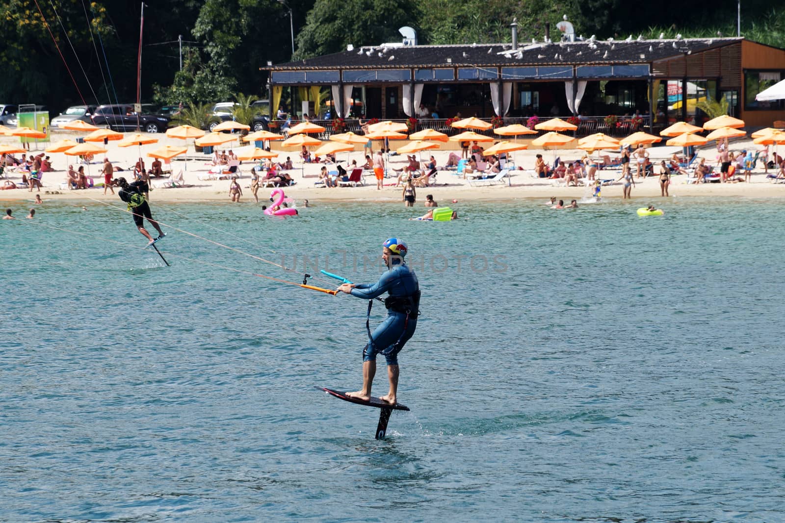 Varna, Bulgaria - July, 19, 2020: a man is kiting the sea against the background of the beachVarna