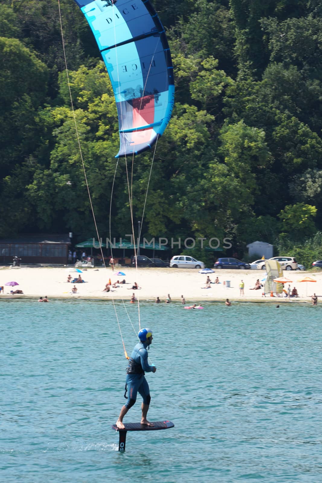 Varna, Bulgaria - July, 19, 2020: a man is kiting the sea against the background of the beachVarna