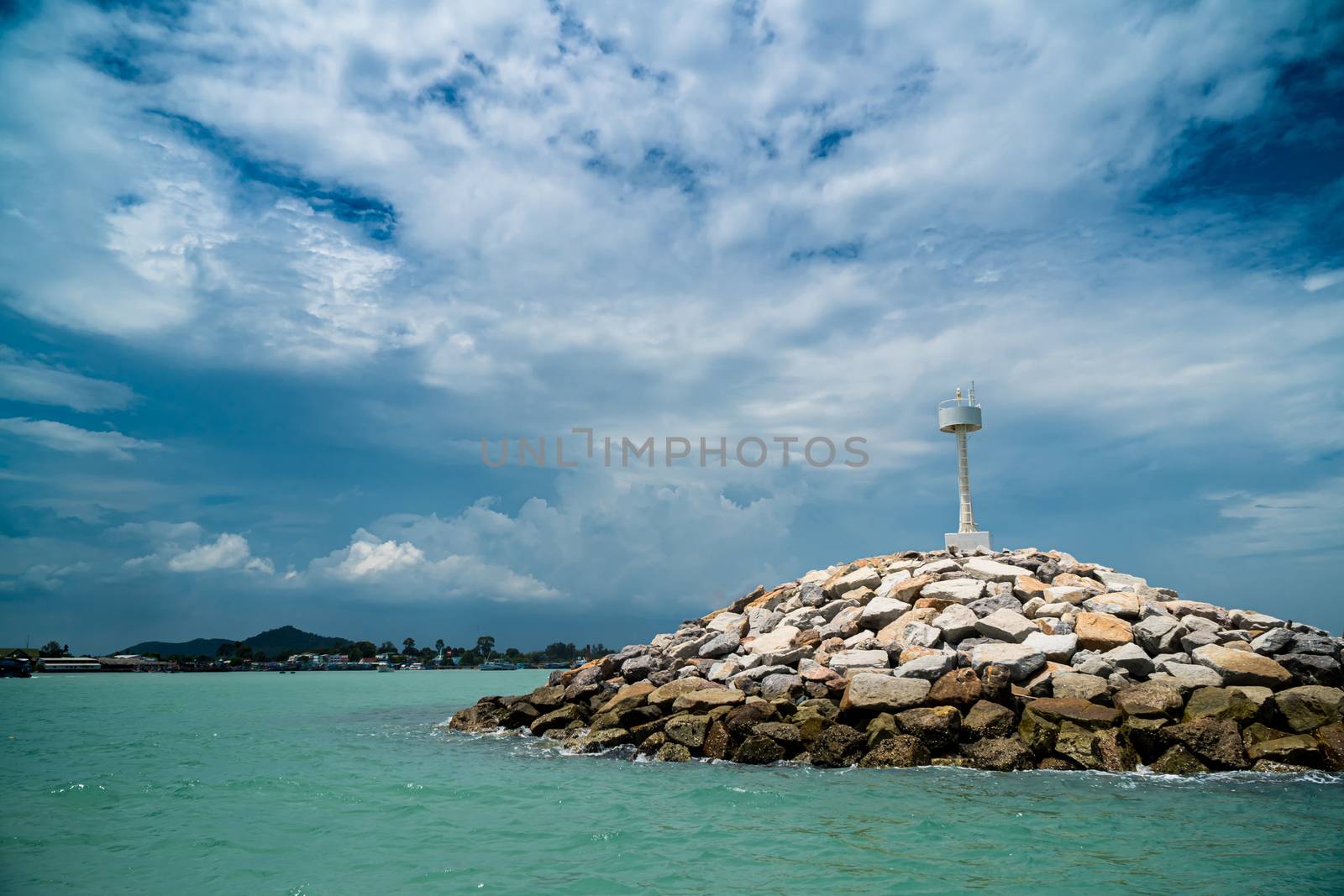 The breakwater line is constructed from rock in the sea.