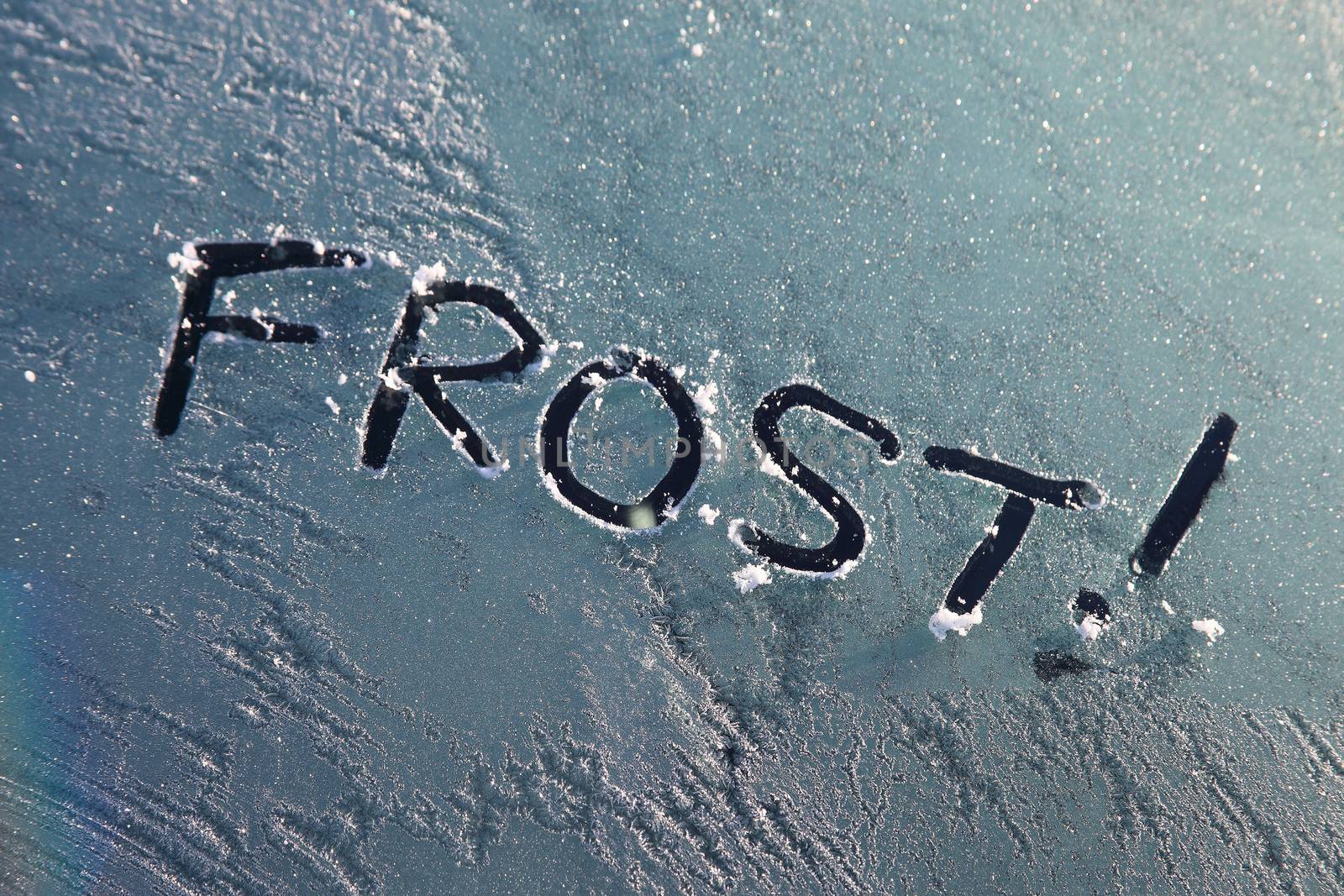 Frozen car window with a frost message text sign in the winter stock photo