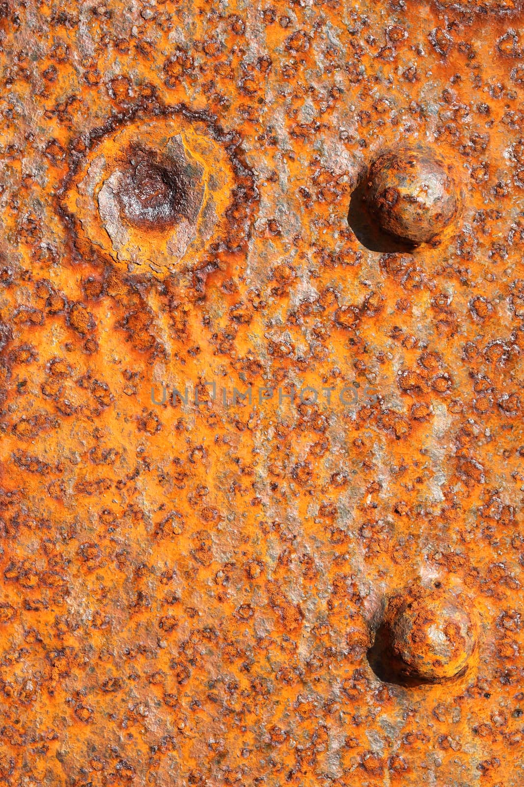 Rusty background texture close up of old distressed weathered iron panel covered in rust stock photo
