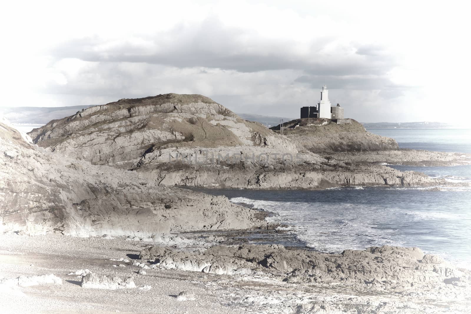 Pastel image of The Mumbles with it's lighthouse as seen from Bracelet Bay on the Gower Peninsular West Glamorgan,Wales UK, a popular Welsh coastline travel destination for tourist visitors stock photo