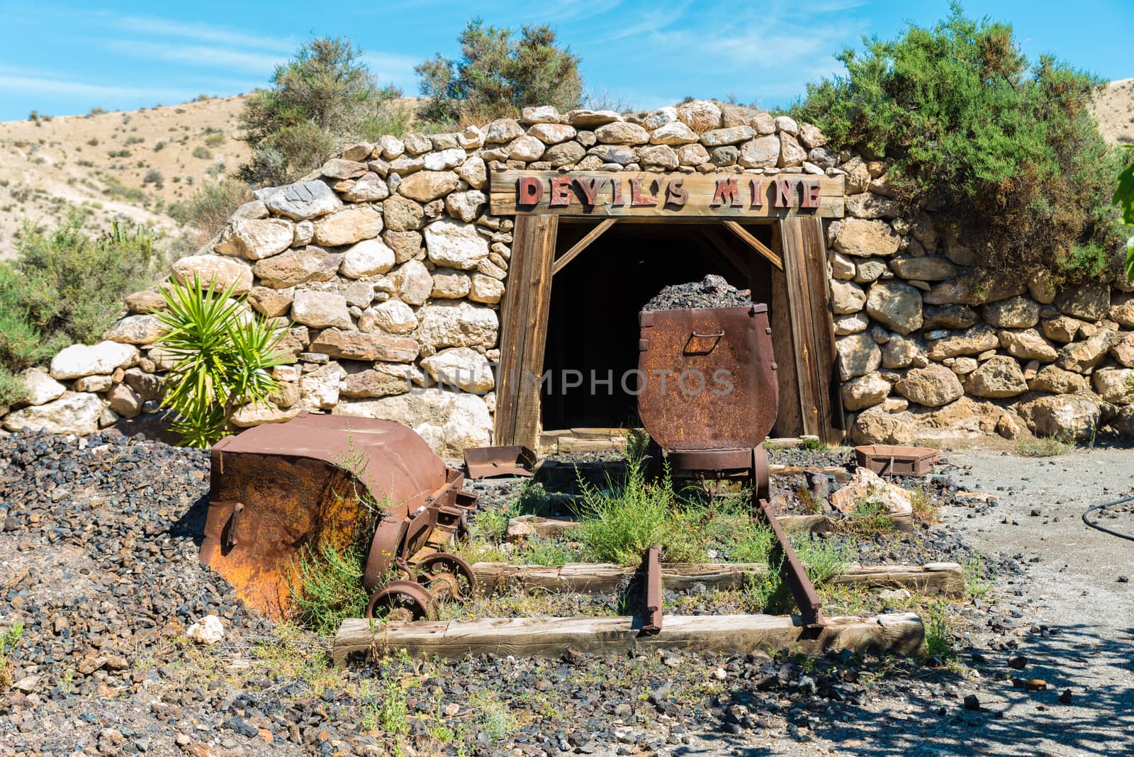 Entrance to a mining shaft with old timbers