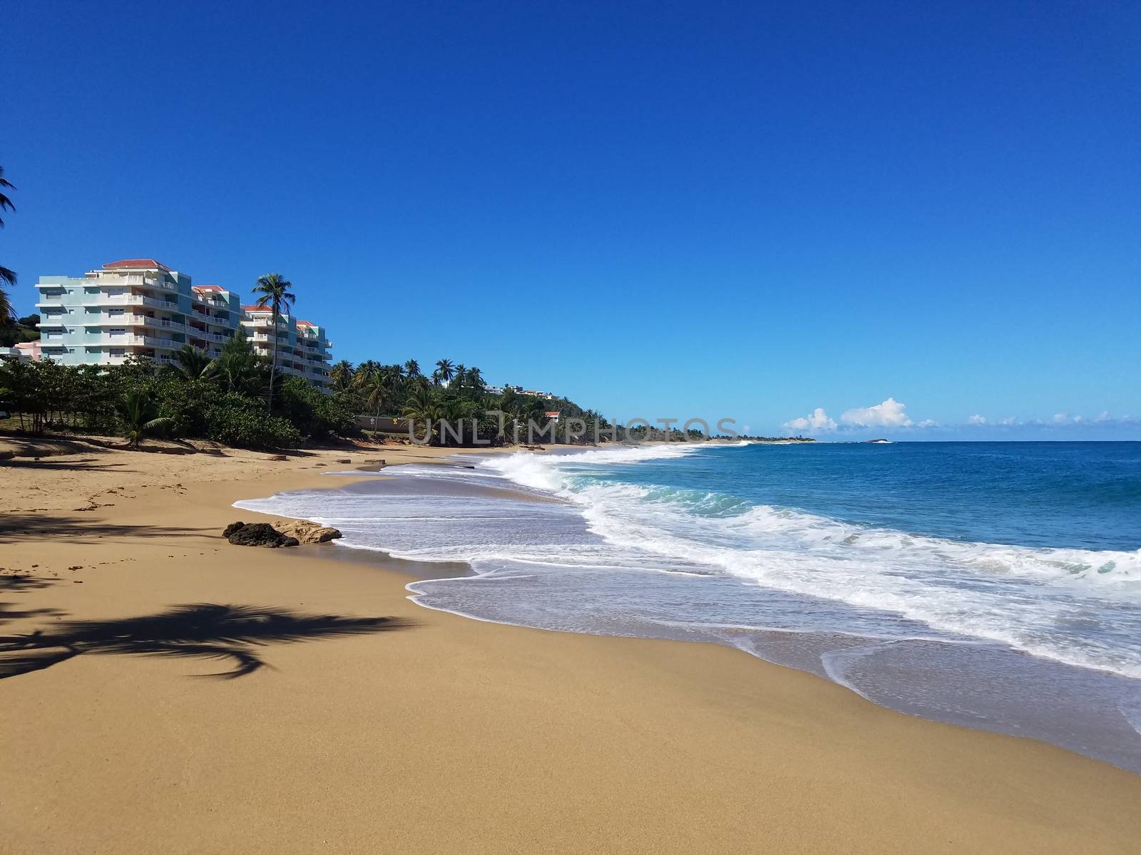 sand and ocean or sea water on beach in Isabela, Puerto Rico