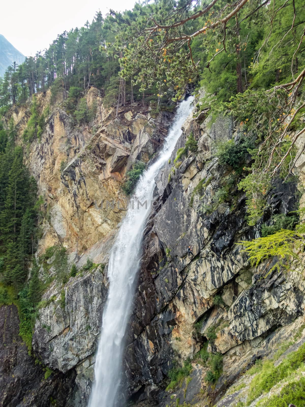 Climbing at the Lehner Waterfall via ferrata near Oberried in the Otztal, Tyrol, Austria