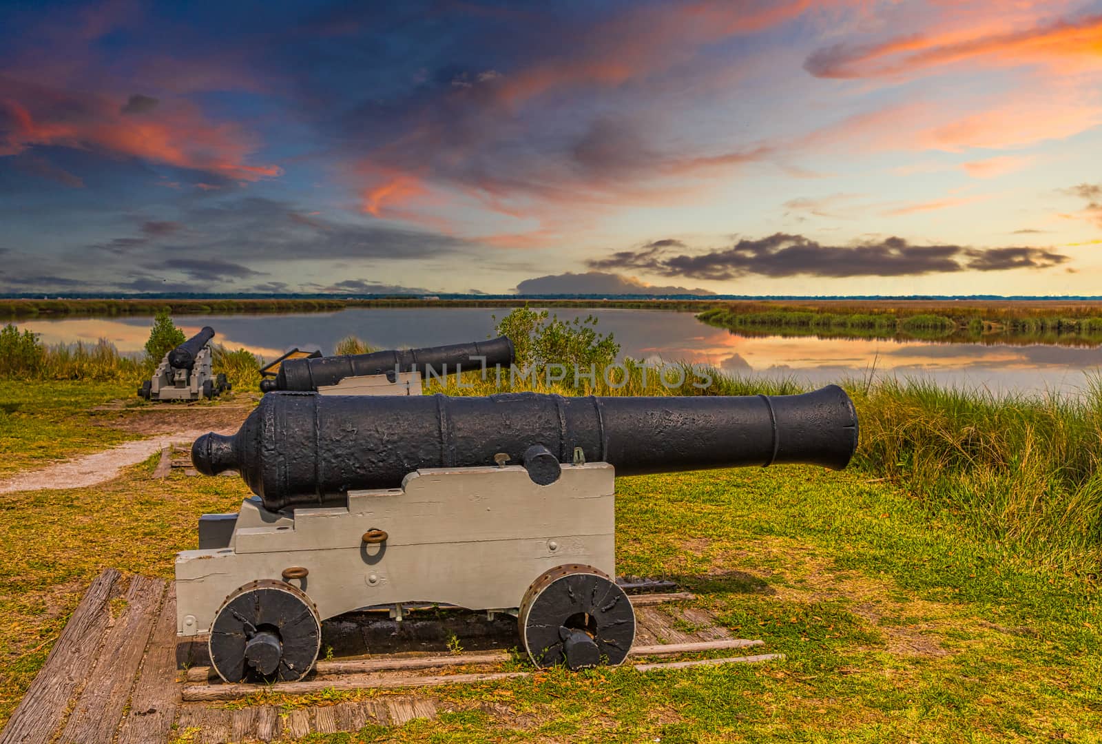 Cannons at Fortification at Sunset by dbvirago