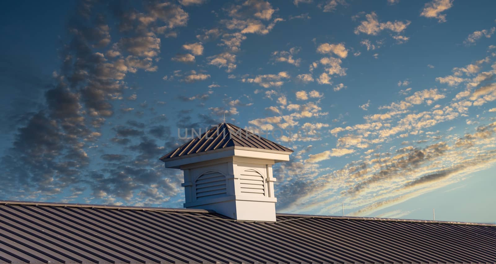 Wood cupola on an old pier roof under blue sky