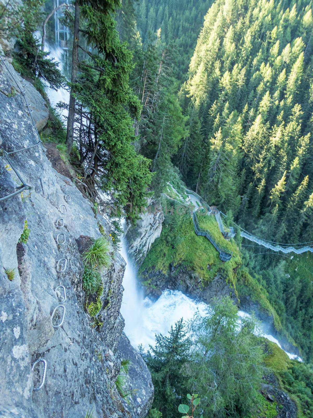 Climbing on the Stuibenfall via ferrata near Umhausen in the Otztal, Tyrol, Austria