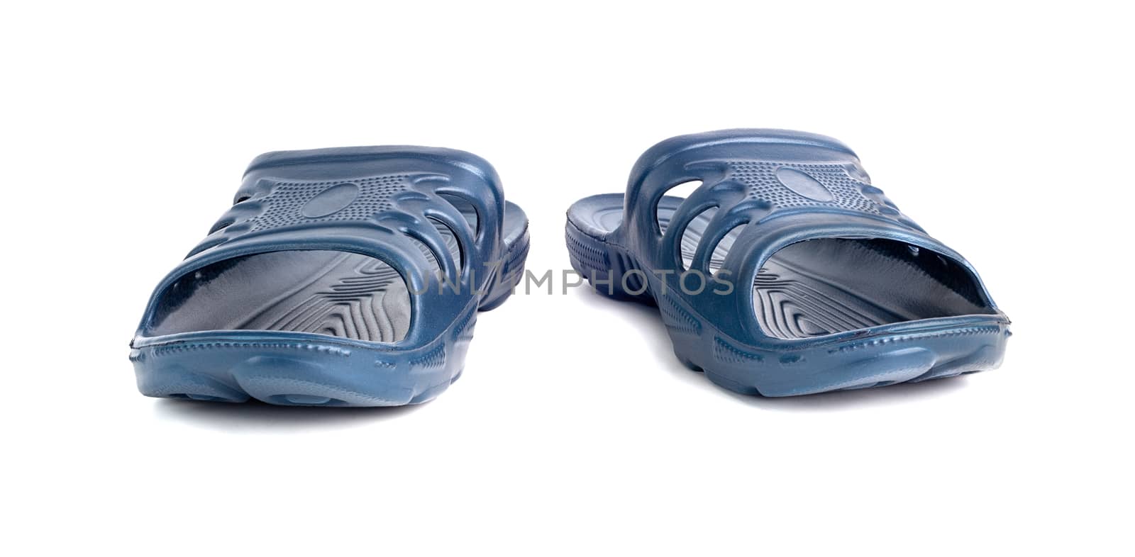 a pair of cheap durable blue rubber slippers isolated on white background.