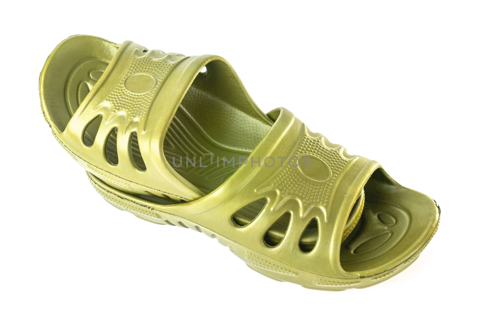 a pair of cheap durable yellow rubber slippers one inside other isolated on white background.
