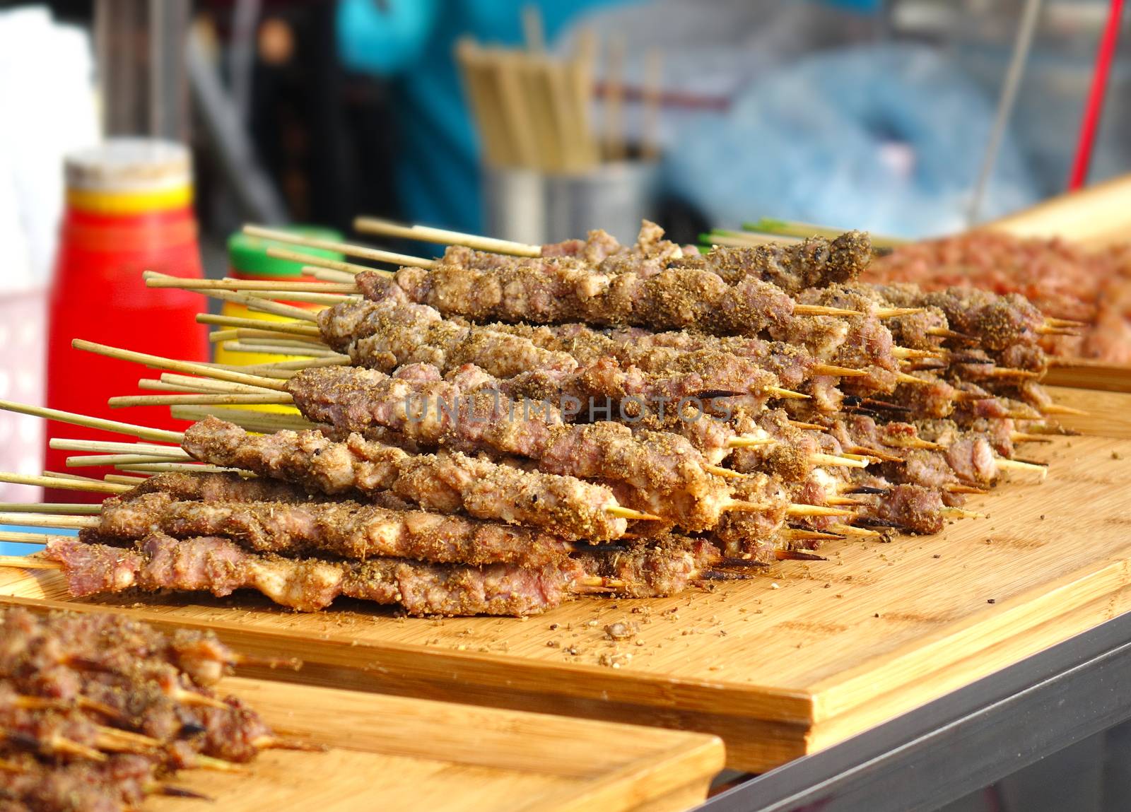 A street food stall in Taiwan offers meat skewers with Mideast spices