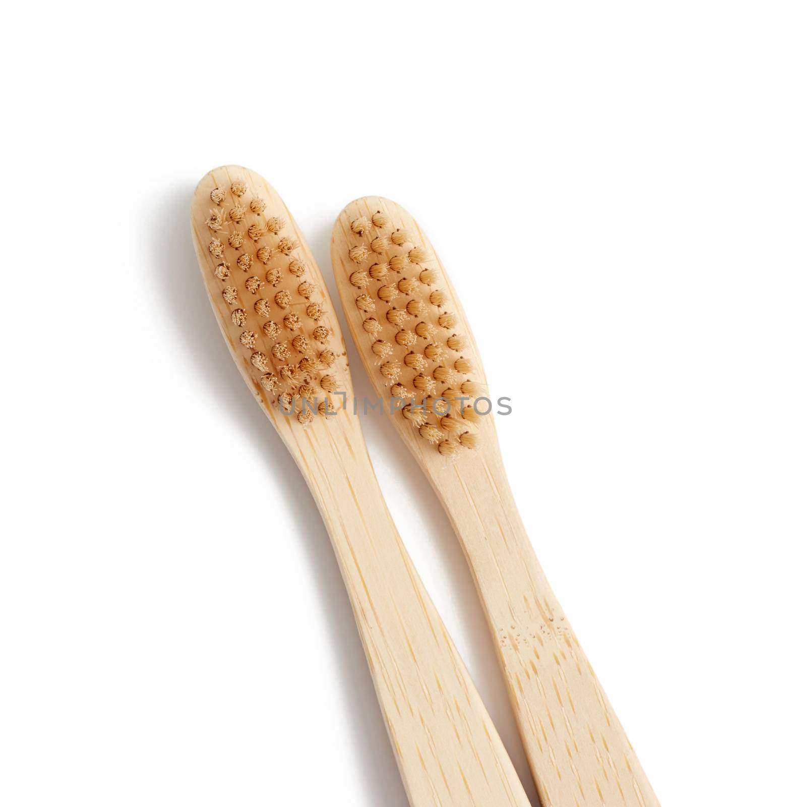 two wooden toothbrushes on a white background, plastic rejection concept, zero waste 