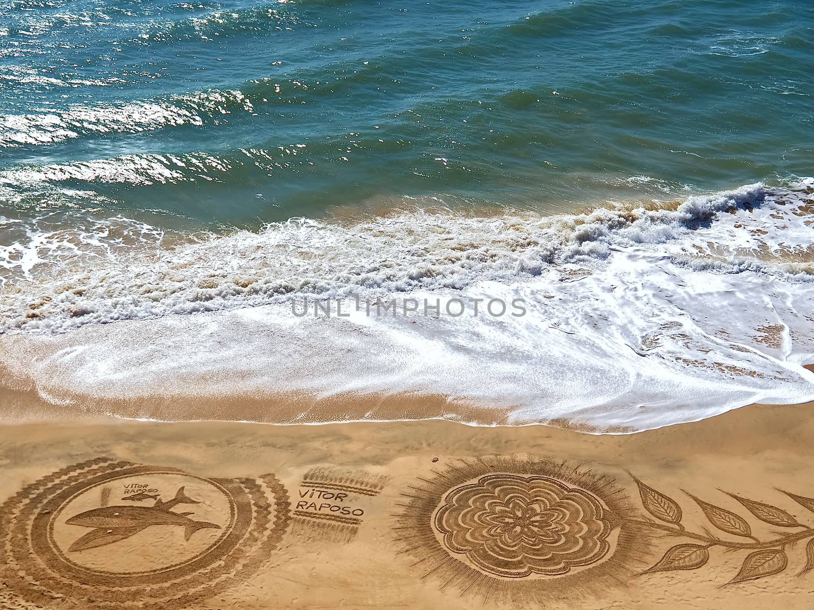 Beautiful beach mandala with a flower and dolphins in Albufeira  by Stimmungsbilder