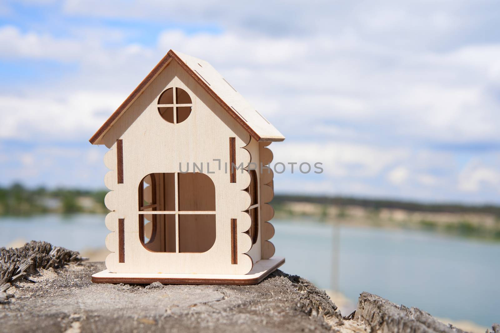 Miniature wooden house outdoor nature. Real estate concept. Modern housing. Eco-friendly energy efficient house. Buying home outside the city Fresh air. Mortgage, loan.