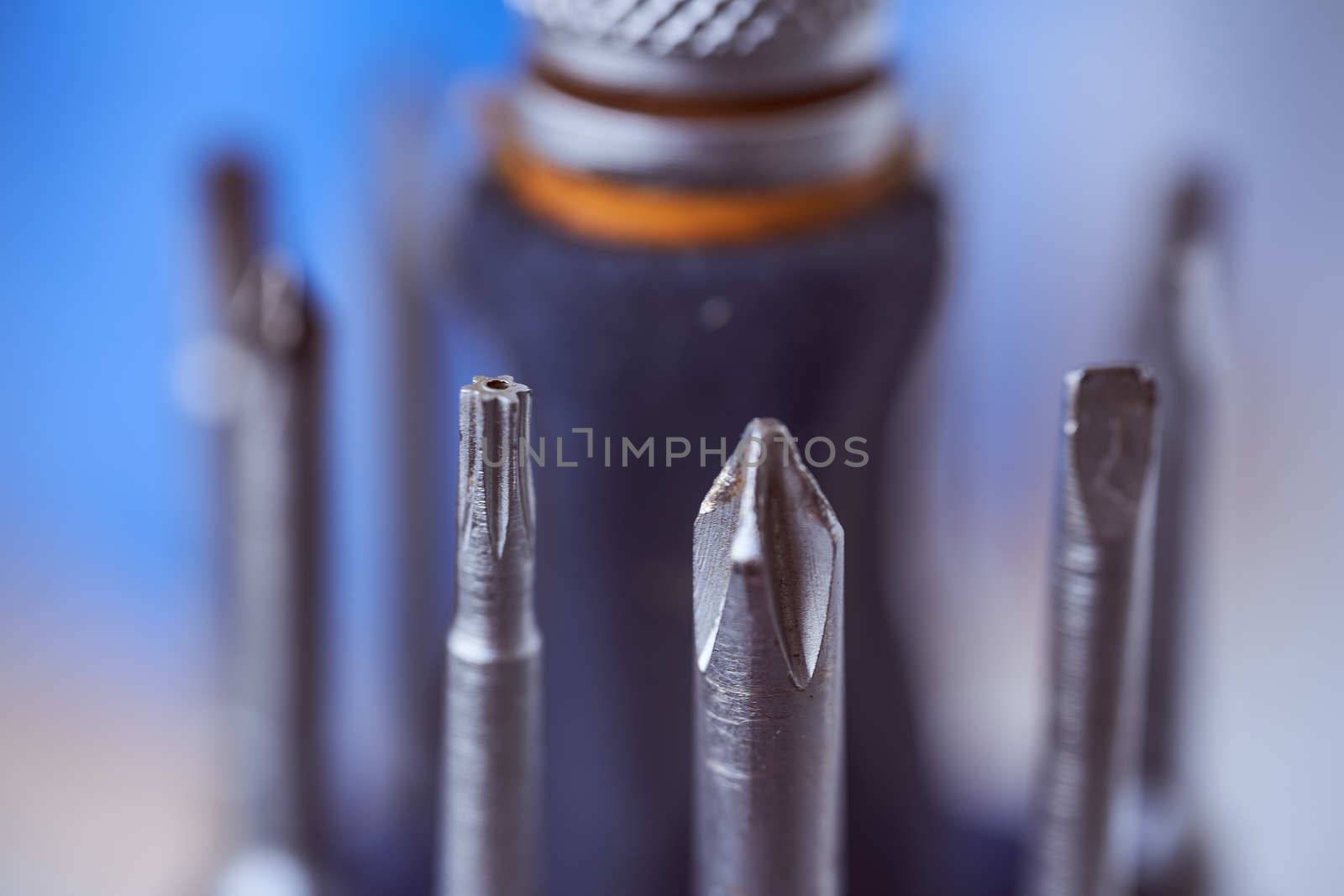 set of screwdrivers on blue blurred background. Close-up. High quality photo