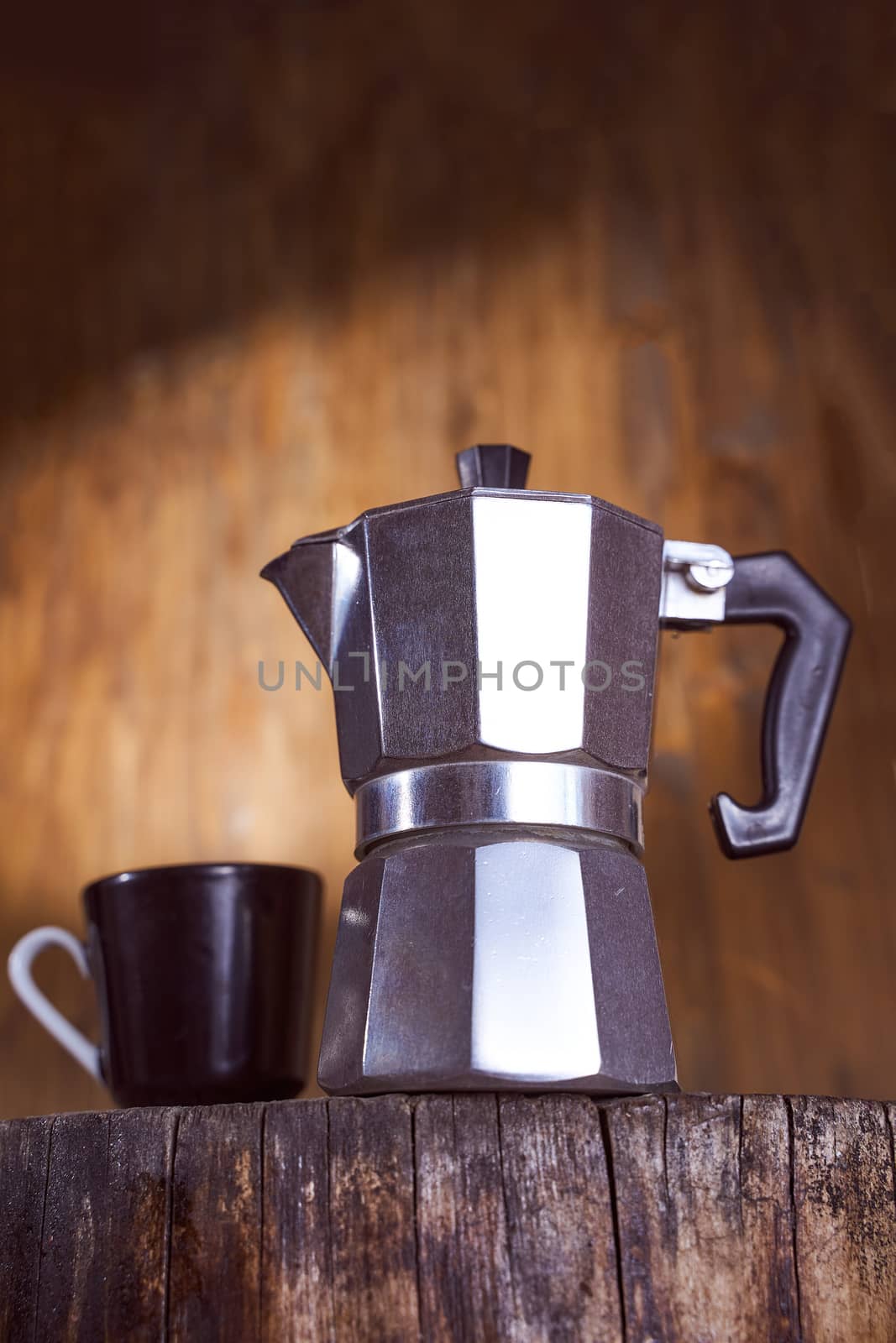 Geyser coffee maker stand on a wooden frame. High quality photo