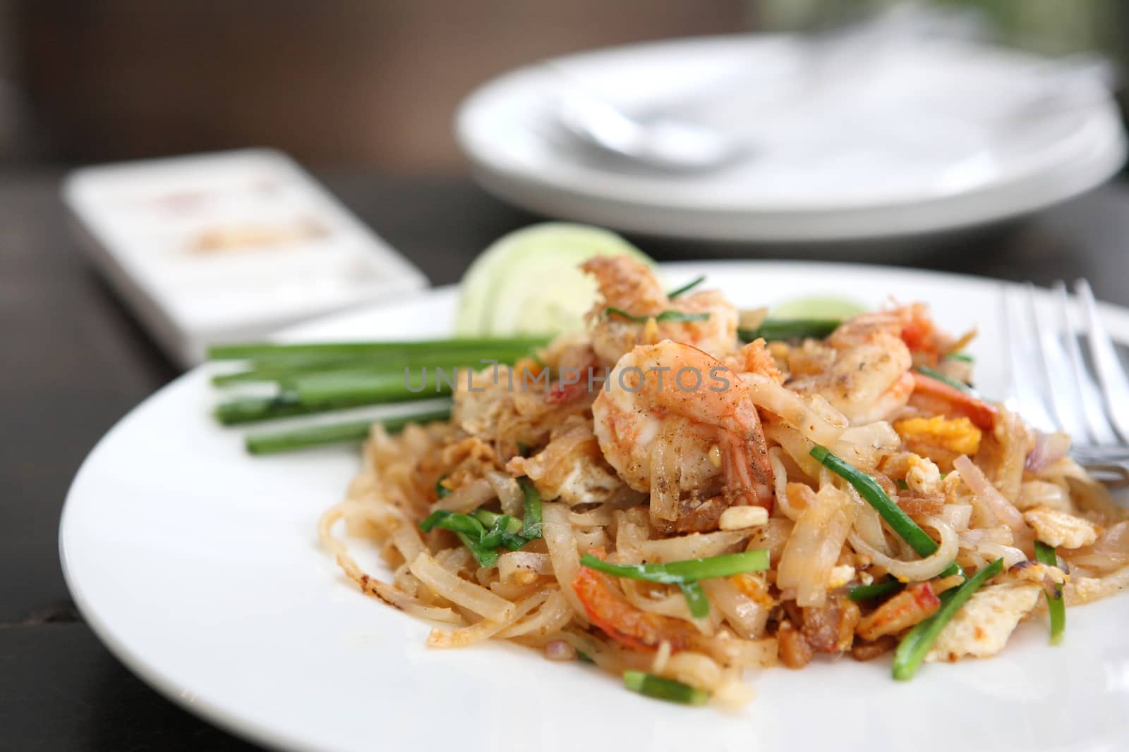 Thai food padthai on wood background by piyato