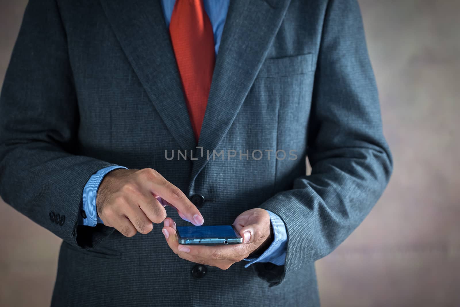Businessman working on a virtual screen of the future. Businessmen are using mobile phones for transactions