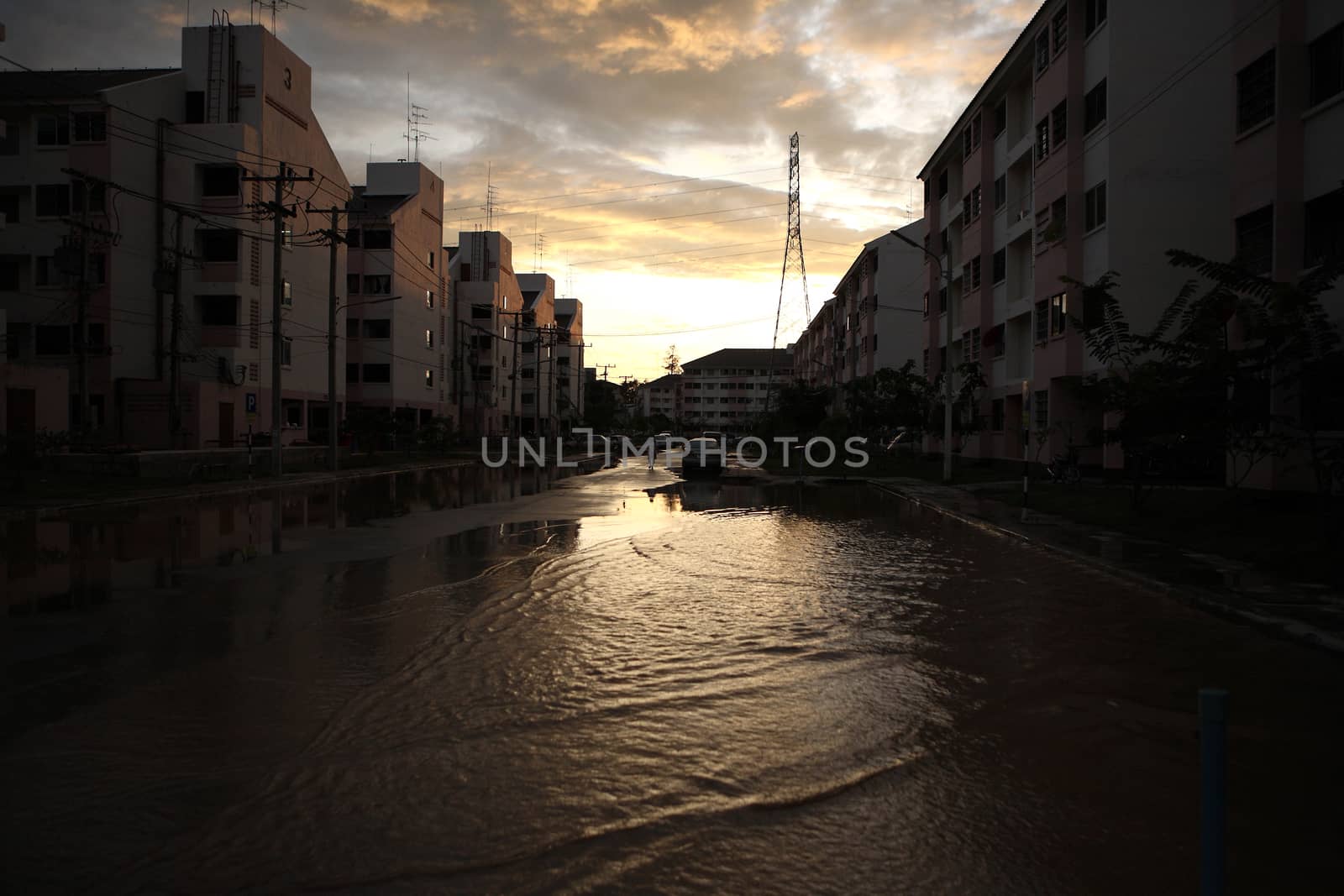 CHIANGMAI , THAILAND - SEPTEMBER 30 : People walking through flooded streets on September 30, 2011 in Nonghoi , Muang , Chiangmai , Thailand.