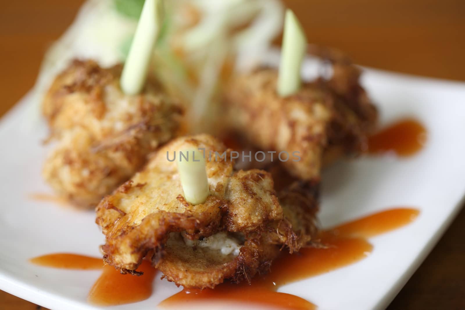 Fried Chicken with lemongrass on wood background