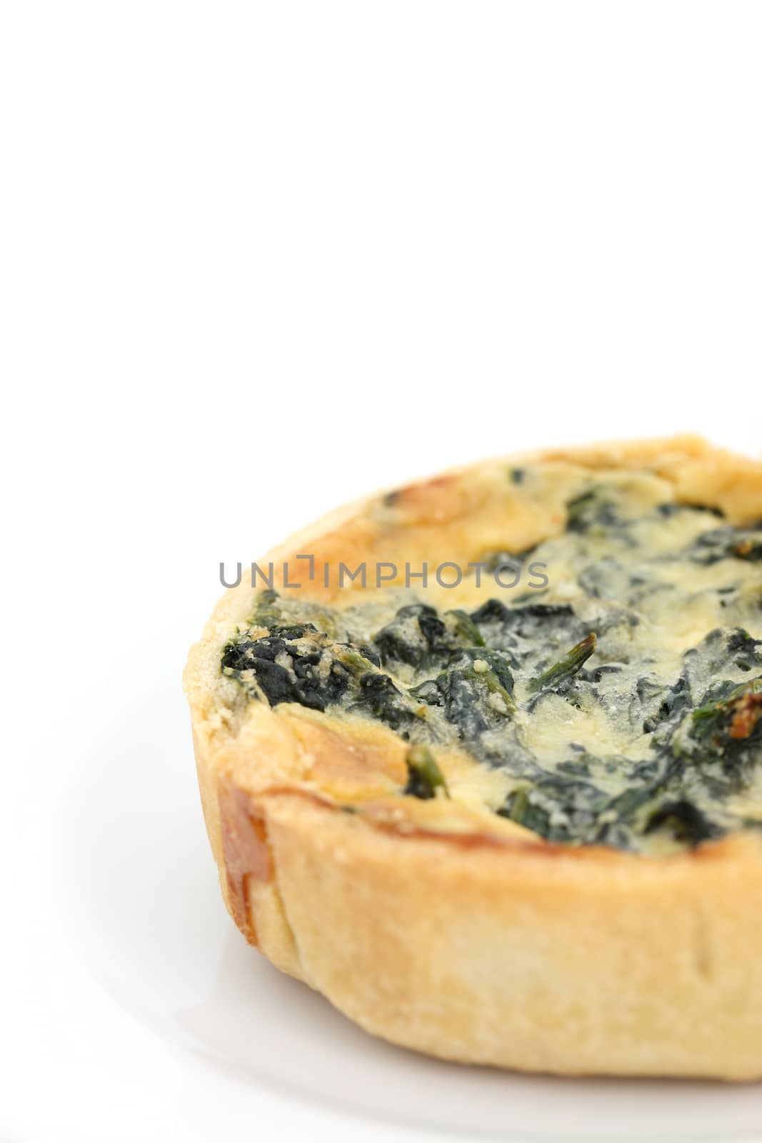 spinach quiche pie isolated on white background
