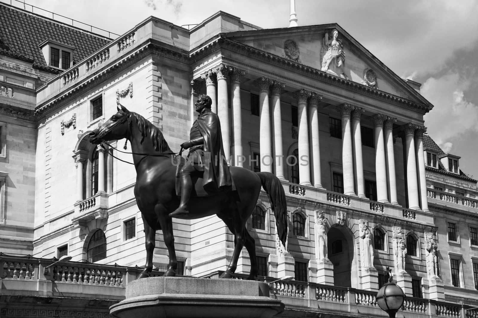 The Bank of England fondly known as The Old Lady Of Threadneadle Street London England UK with an equestrian statue of the Duke of Wellington in the foreground stock photo