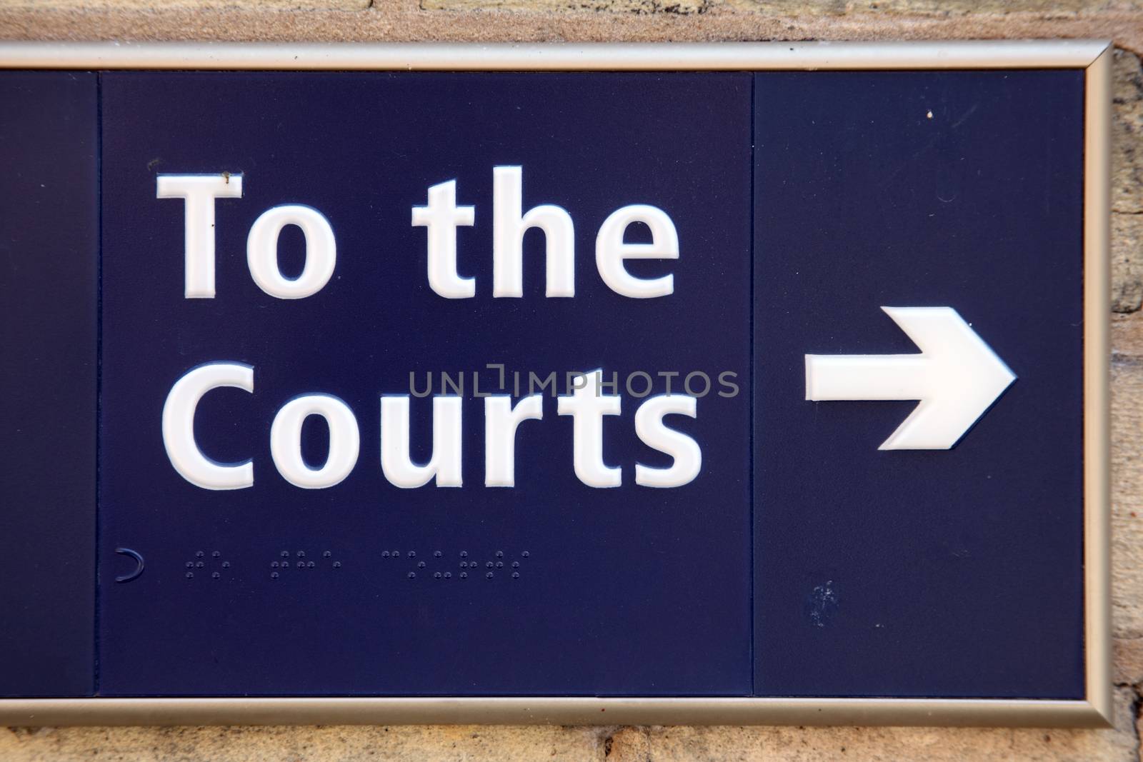 To the law courts blue direction arrow sign stock photo