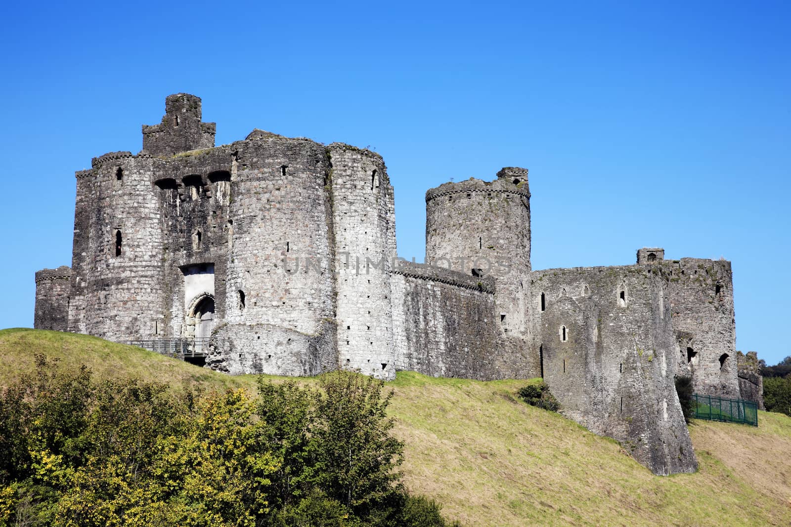 Kidwelly Castle Carmarthenshire Wales UK is a ruin of a 13th century medieval castle and a popular travel destination landmark of the town stock photo