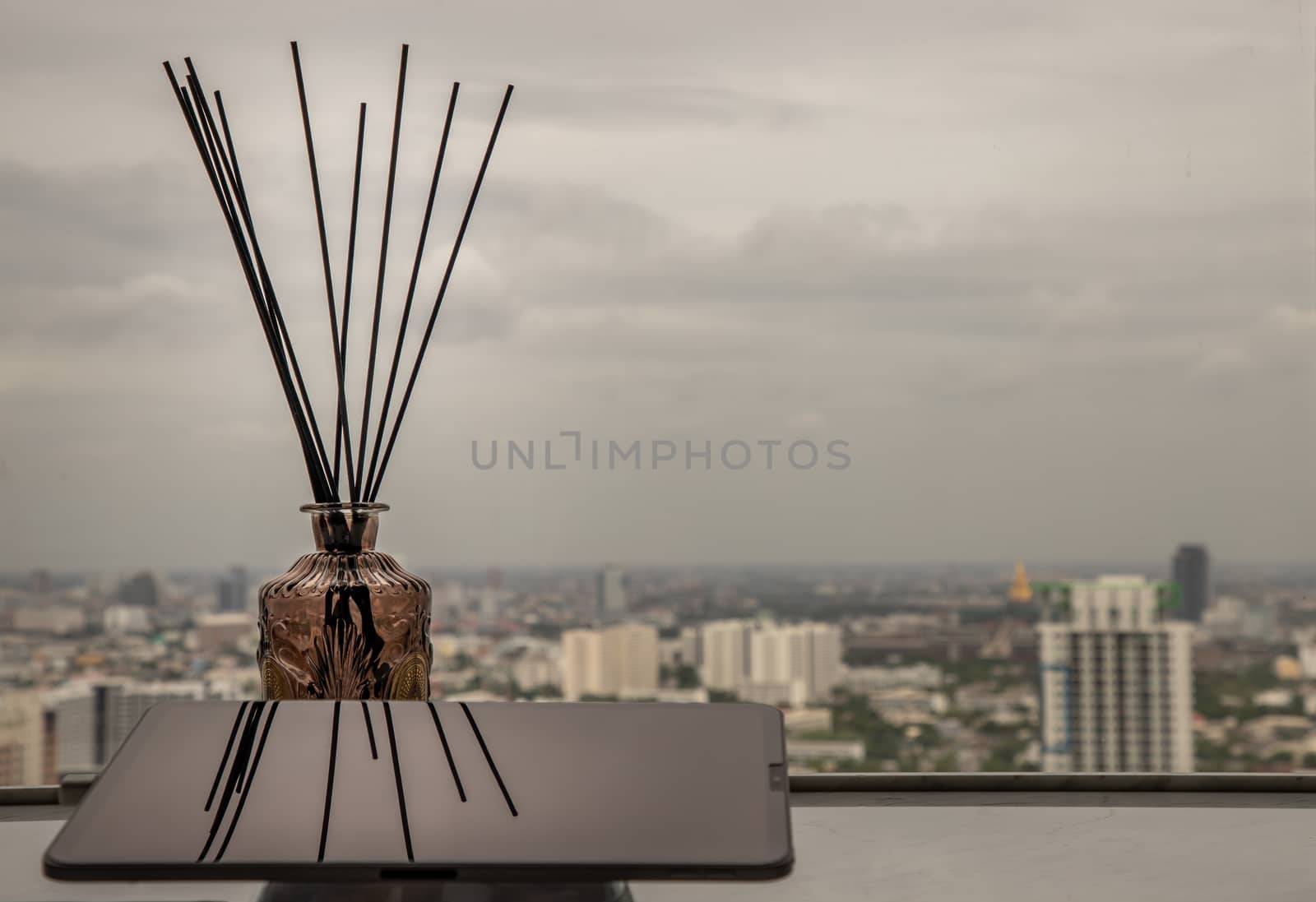co-working space or shared office space, located on a high floor of a building, with a view of the sky and city skyline. Copy space, Selective focus.