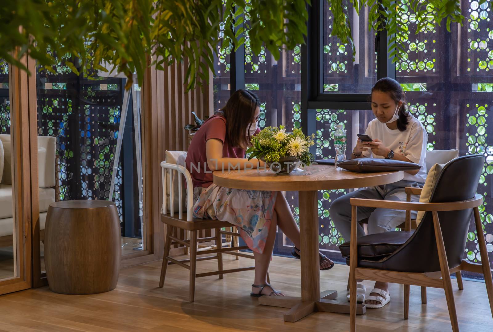 Bangkok, Thailand, Jul 04, 2020 : A meeting of two ladies in co-working space. New normal concept. Selective focus.