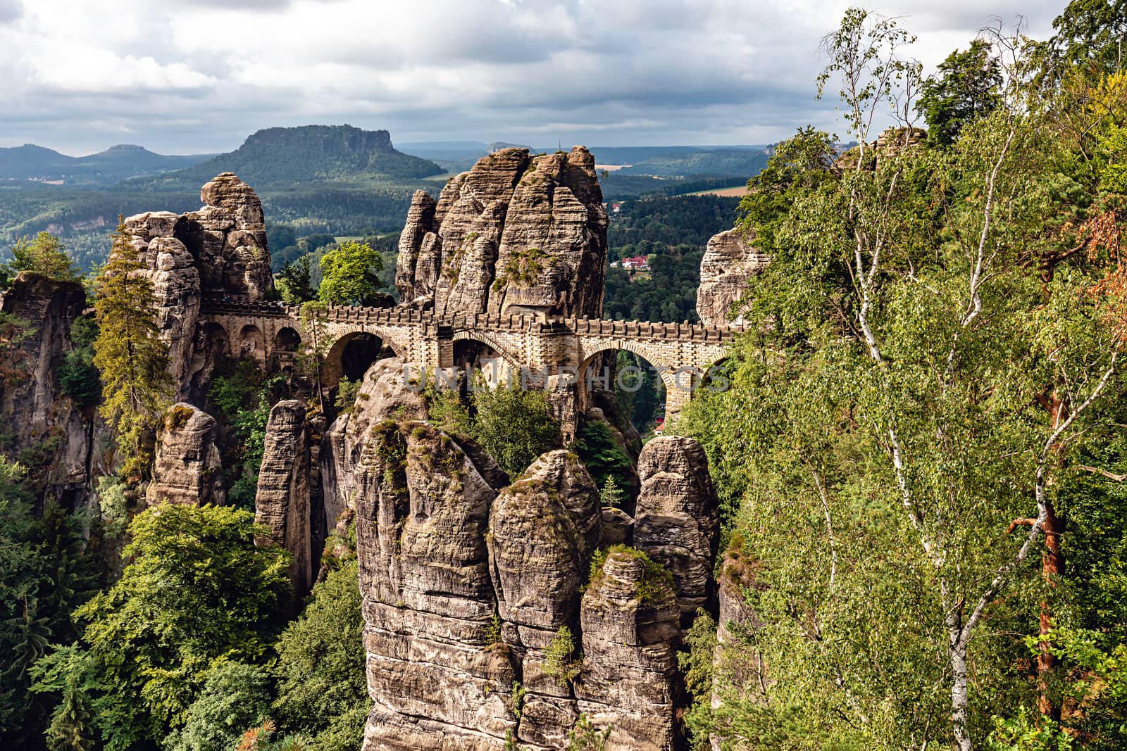 Bastei, view of the Bastei bridge and stone gate. Bastei is famous for the beautiful rock formation in the Saxon Switzerland National Park near Dresden. Popular travel destination in Saxony.