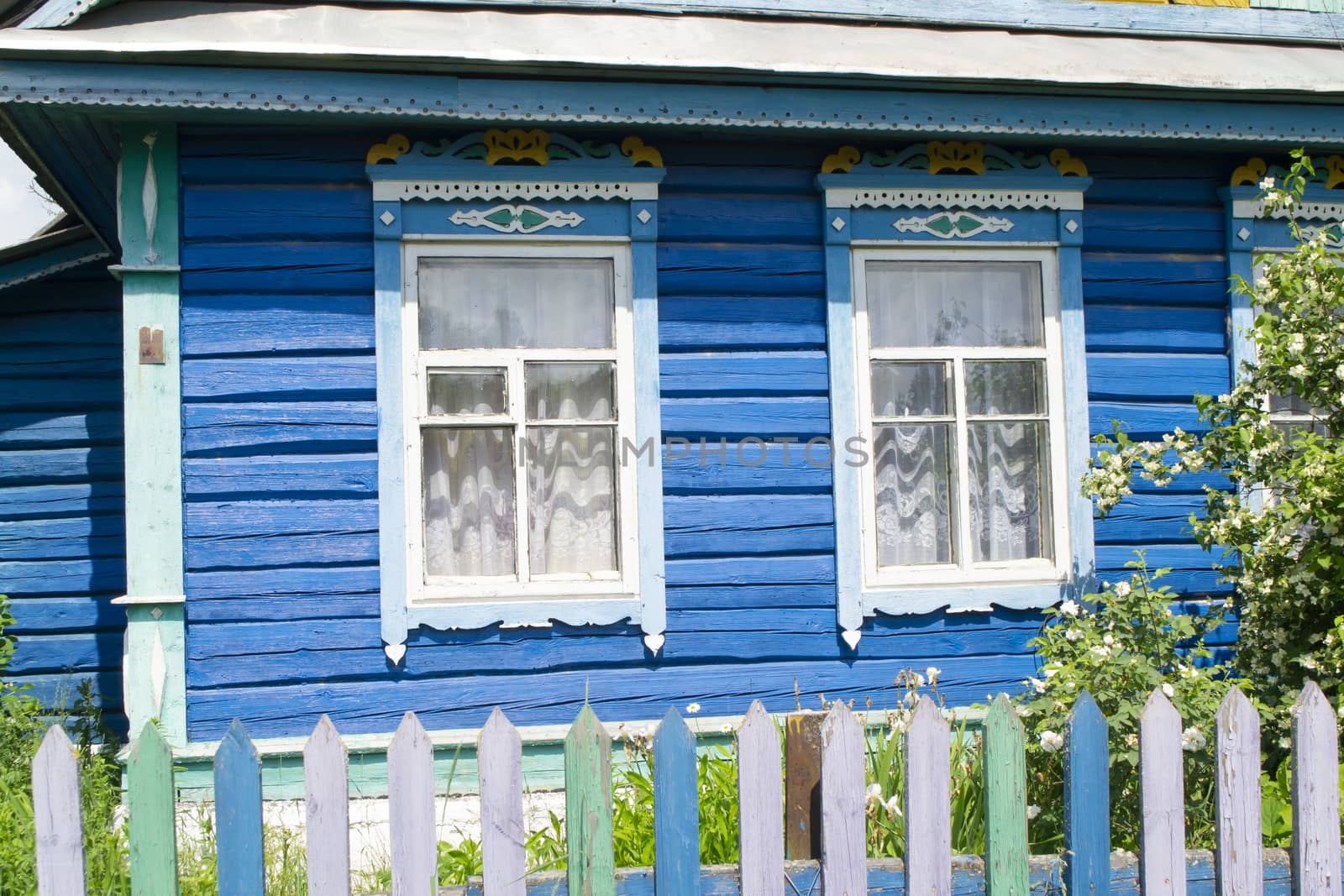 Carved windows in old national wooden ancient country house in Belarus