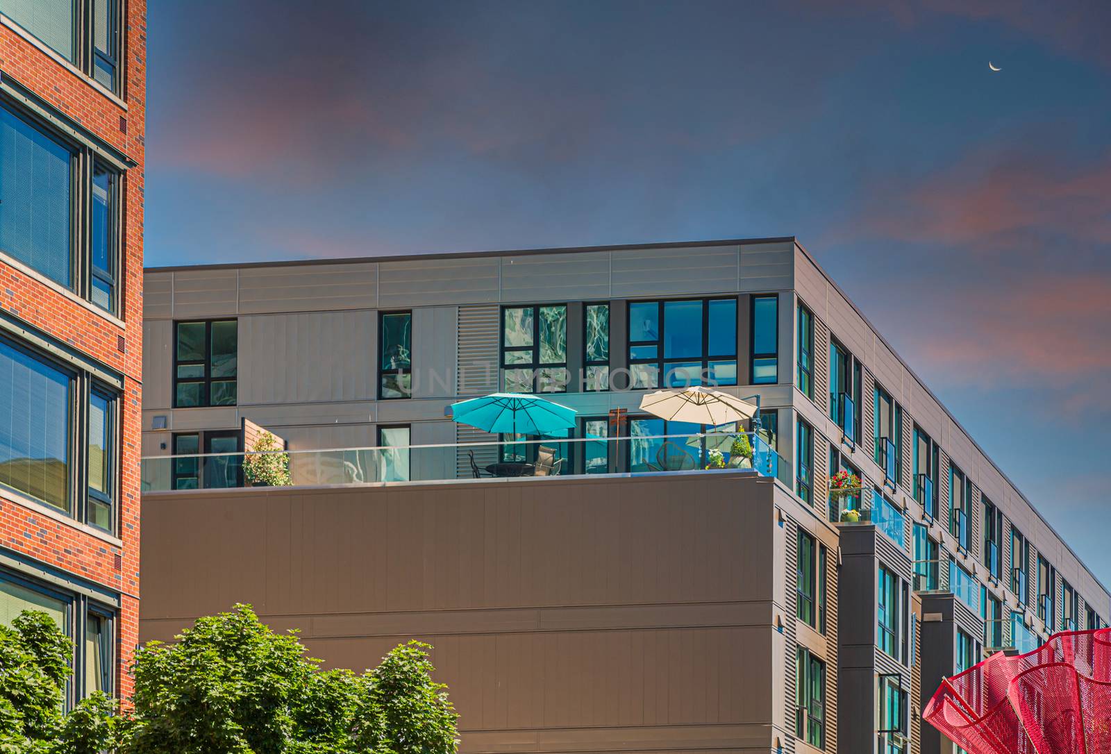 Umbrellas on Condo Balcony at Dusk by dbvirago